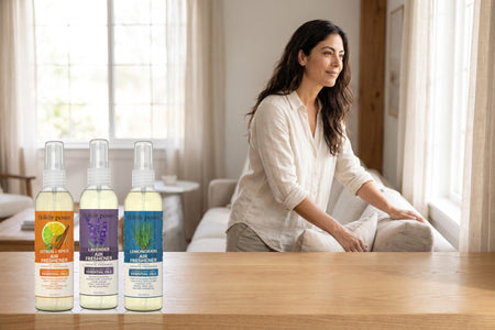Variety 3-Pack Air Fresheners β Citrus & Spice, Lavender, Lemongrass on a wooden console in a bright living room