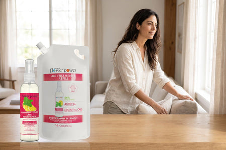 Peppermint & Lemon Air Freshener + 4X Refill Bundle on a wooden console in a bright living room