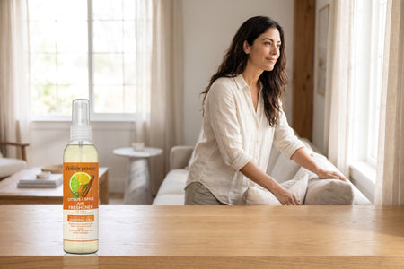 Citrus & Spice Air Freshener on a wooden console in a bright living room