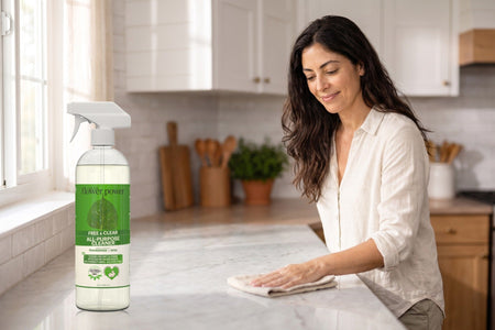 Free & Clear All-Purpose Cleaner Concentrate while she wipes the kitchen counter