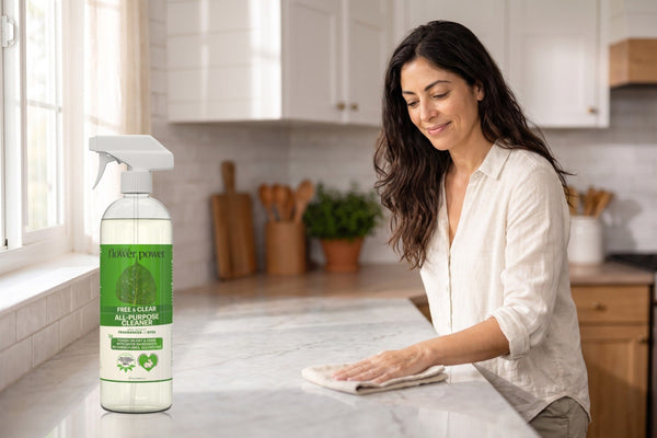 Free & Clear All-Purpose Cleaner Concentrate while she wipes the kitchen counter