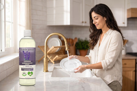 Lavender Liquid Dish Soap while she rinses a plate at the kitchen sink