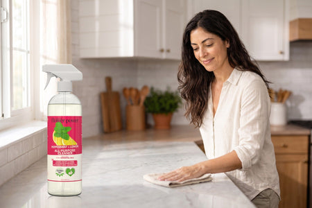 Peppermint & Lemon All-Purpose Cleaner Concentrate while she wipes the kitchen counter