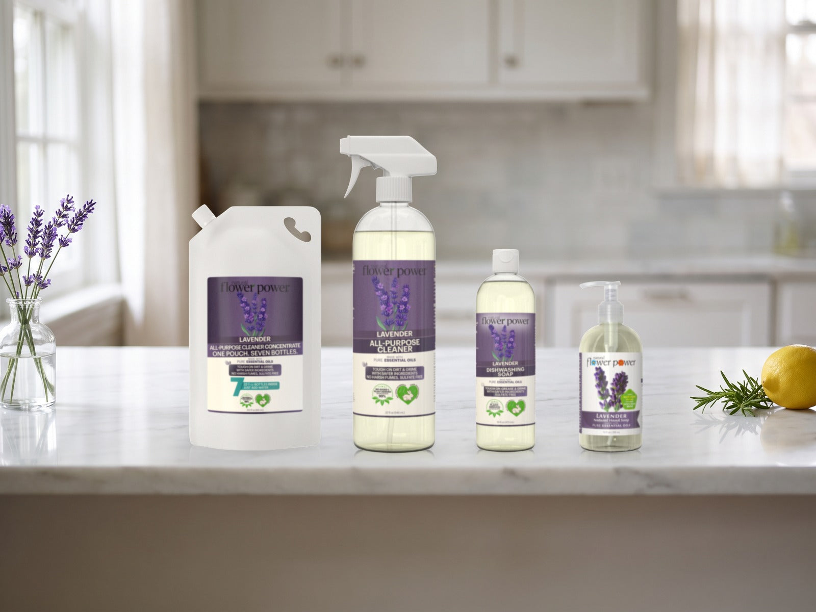 The Clean Home Starter Set in Lavender on a kitchen counter: all-purpose cleaner, 7X refill pouch, dish soap and hand soap